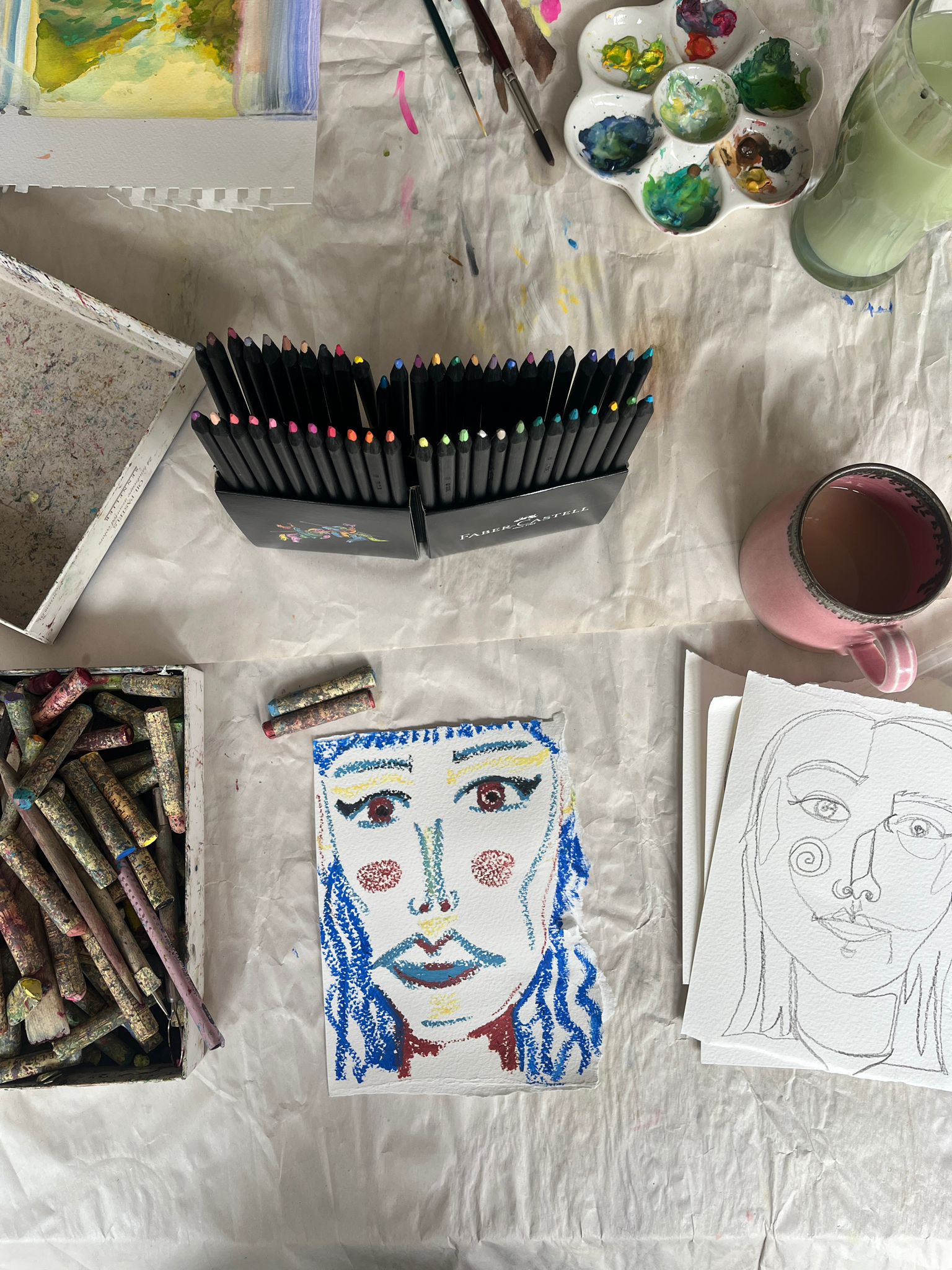 Crafting materials and portrait drawings
