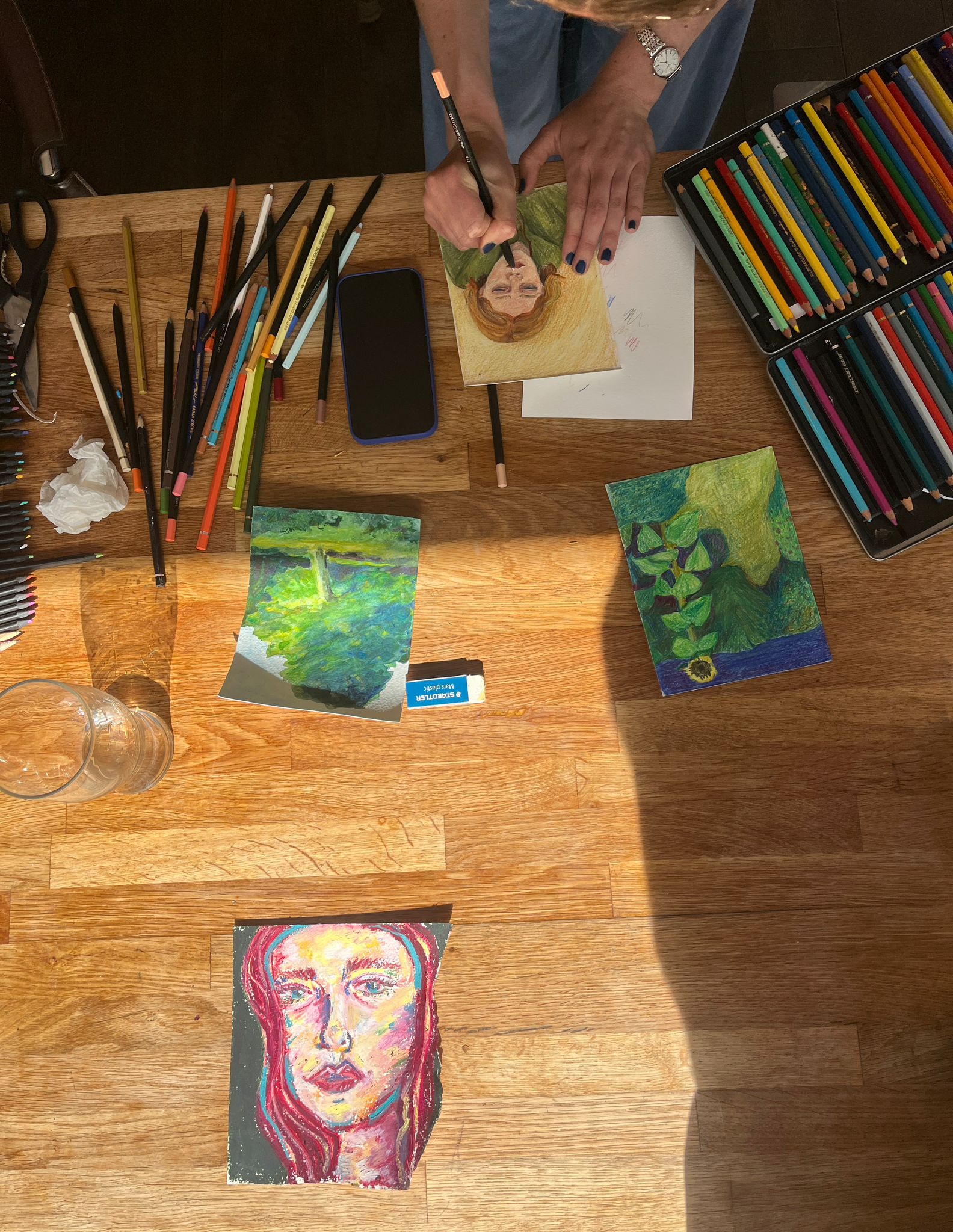 Painting portraits at the craft night table